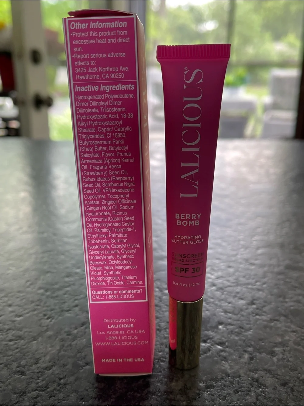 LALICIOUS Hydrating Butter Gloss SPF 30 in Berry Bomb shine shield plump hydrate